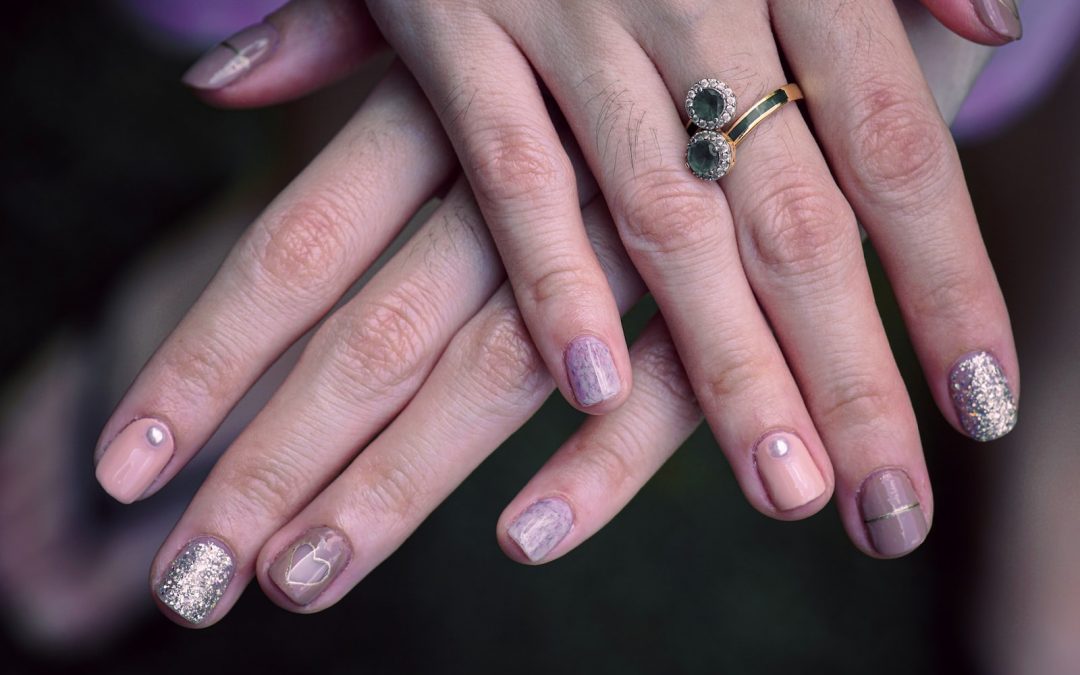 woman with manicure and ring