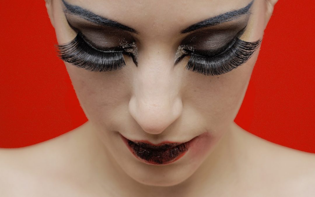 woman with black lipstick and red lipstick